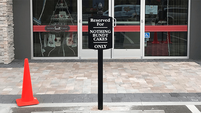 Black decorative cast frame parking sign